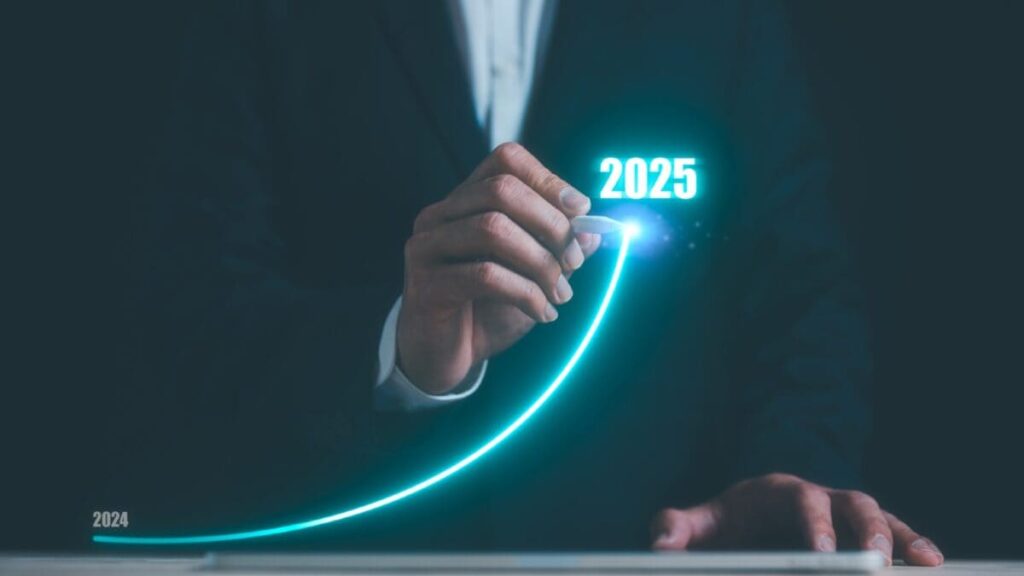 Businessman using pen drawing line for increasing arrow from 2024 to 2025