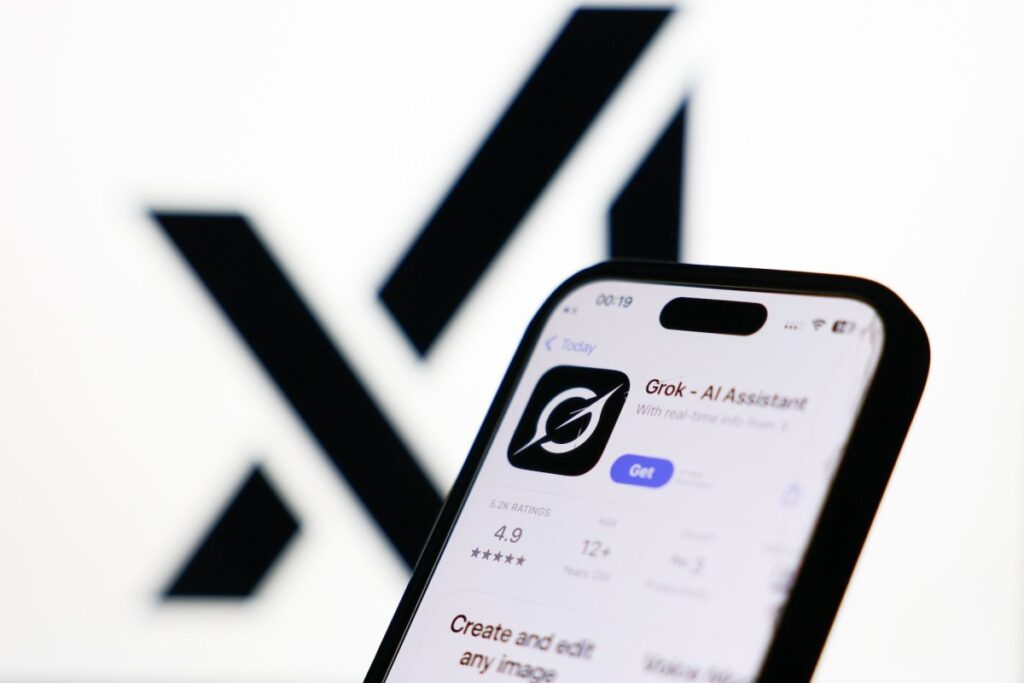 Indonesia blocks Grok over non-consensual, sexualized deepfakes xAI logo displayed on a screen and Grok on App Store displayed on a phone screen