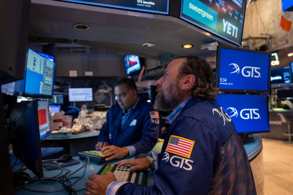 Stocks Little Changed Ahead of Fed Decision, Big Tech Earnings; S&P 500 Hits 7000, Then Turns Lower; Gold Sets Latest Record