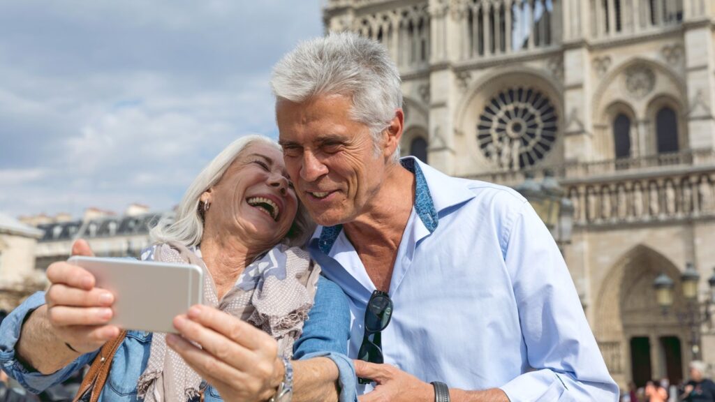 Senior couple in vacation, spending their holidays visiting the beautiful city of Paris, France.