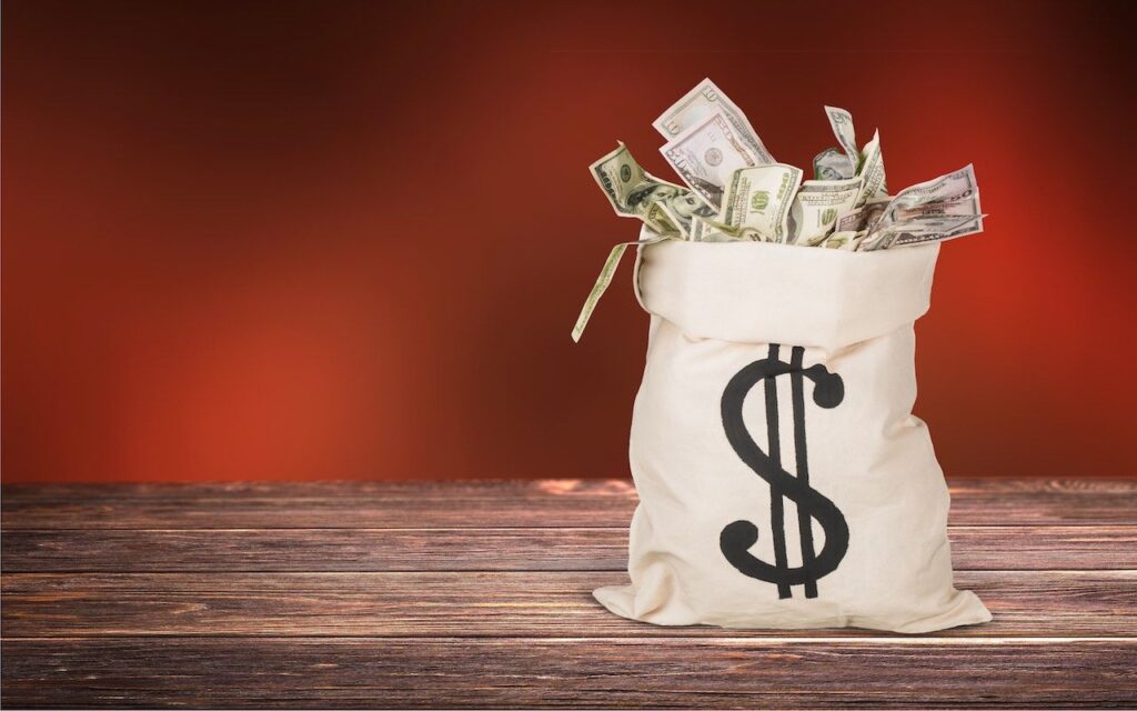 Are Trump Tariff Refunds Coming in 2026? What to Know Now Bag full of money with a dollar sign on it