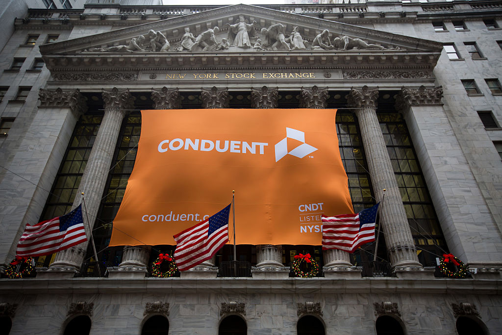 Conduent data breach grows, affecting at least 25M people Conduent Inc. signage is displayed as American flags fly outside of the New York Stock Exchange (NYSE) in New York, U.S., on Tuesday, Jan. 3, 2017. U.S. stocks rose Tuesday, pointing to the biggest gain in a month for Wall Street's first session of the new year, helped by a string of robust economic data from China and Europe. Photographer: Michael Nagle/Bloomberg via Getty Images