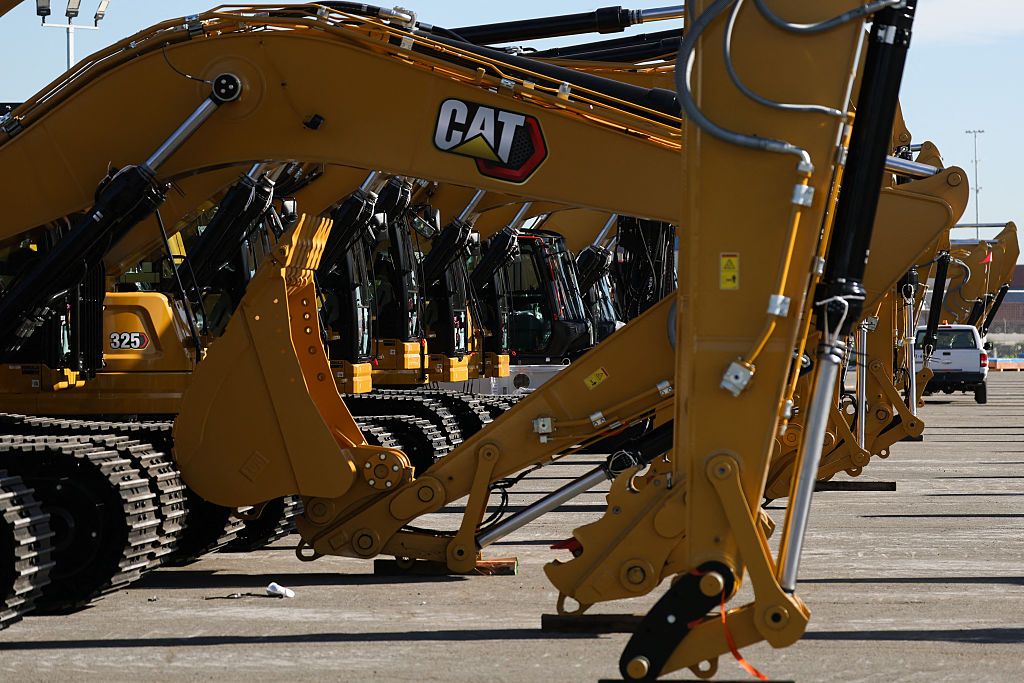 Caterpillar Stock: What a $1,000 Investment 20 Years Ago Is Worth Now Caterpillar Inc. excavators sit on a cargo pier at the Port of Long Beach in California on January 14, 2026.
