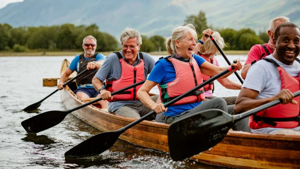 How much passive income could a Stocks and Shares ISA pump out every year? A senior group of friends enjoying rowing on the River Derwent
