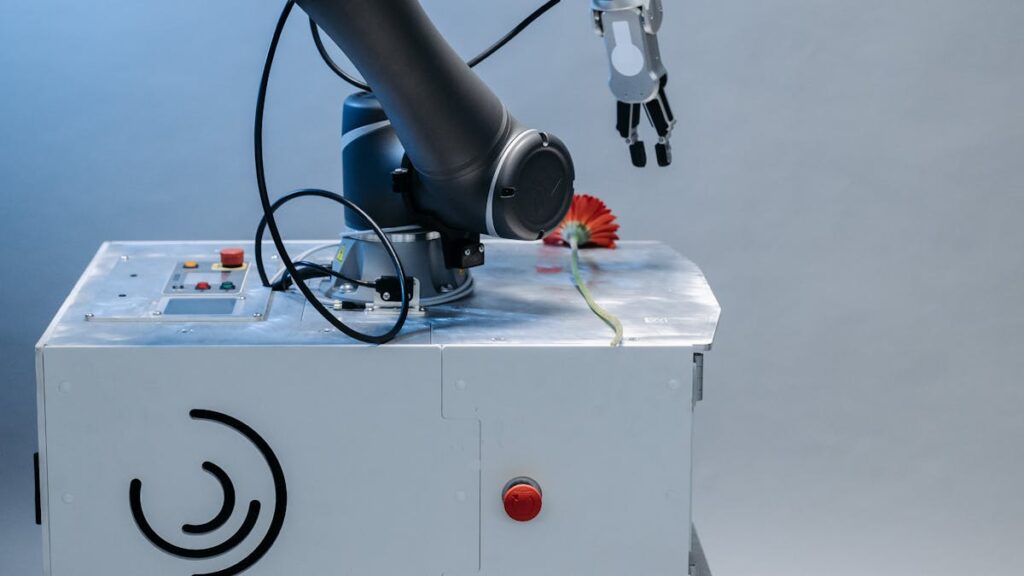 Human and robotic hands illustrating AI and the future of work