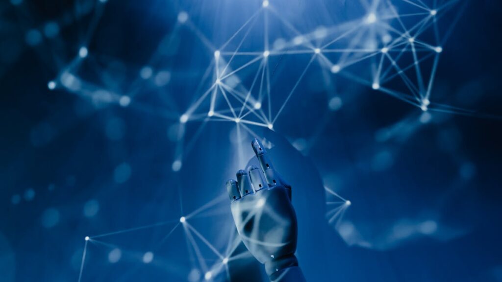 Robotic hand and digital network representing AI tools for small business