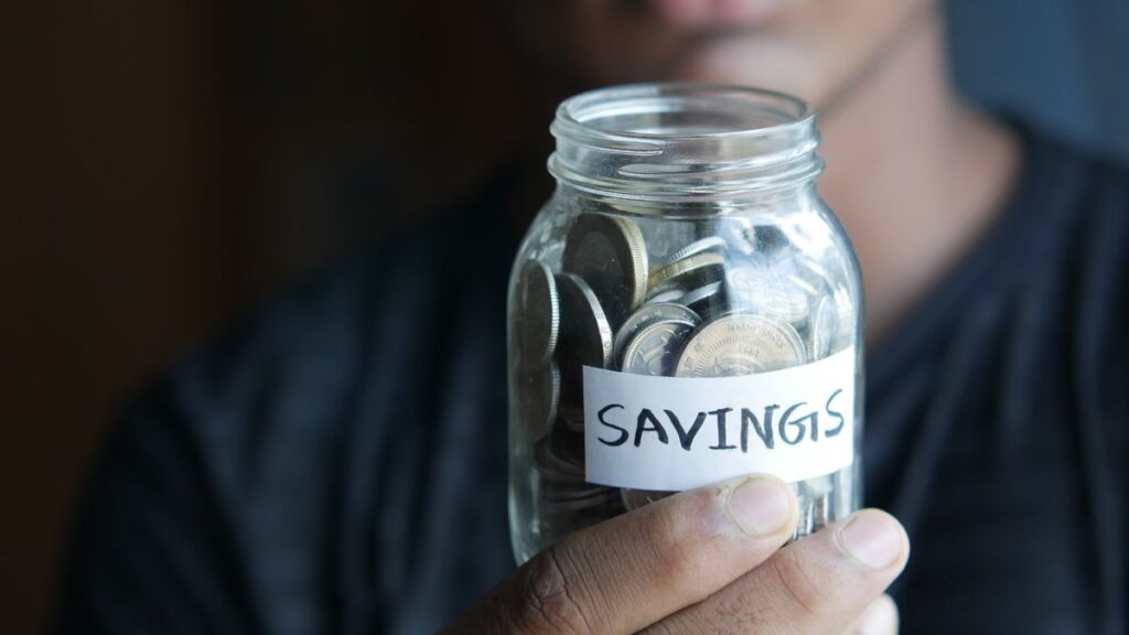 Jar of coins labeled savings for a high-yield savings account