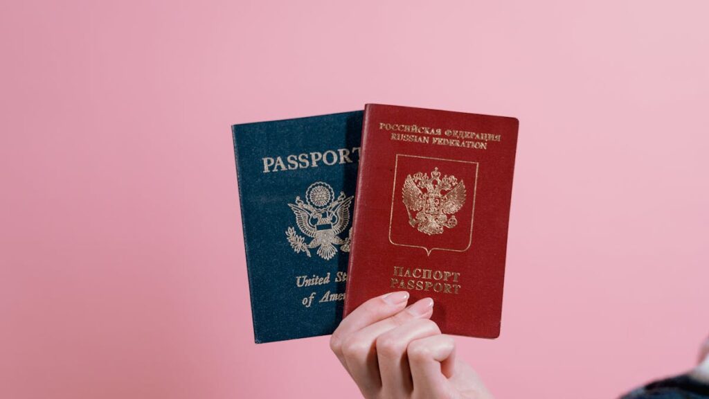 Hand holding a US passport relevant to the H-1B visa 2026 rules
