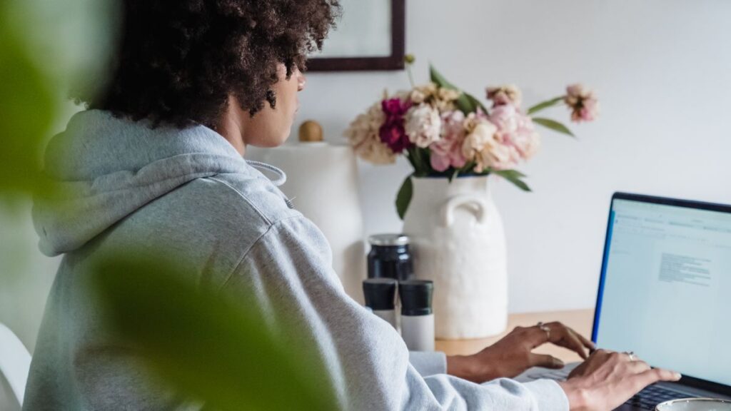 Woman working from home enjoying remote work savings