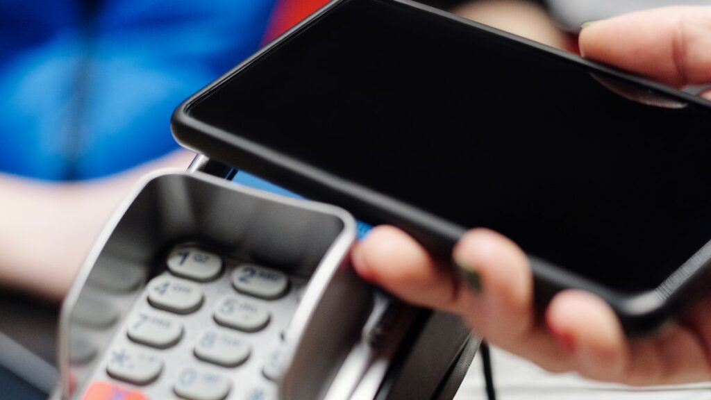 Stablecoin Remittances Explained: How Sending Money Home Could Get 90% Cheaper Stablecoin remittances, a person making a digital payment on a smartphone, cheaper money transfers