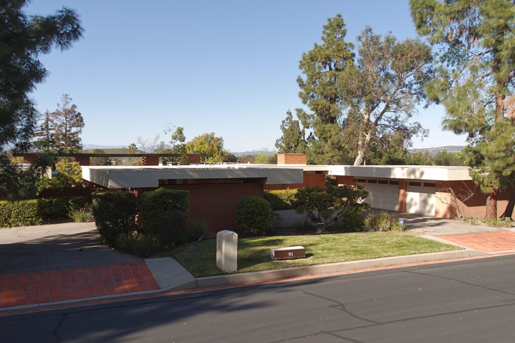 What is the California Cost of Living for Single Adults? A modern residential street showing the california-cost-of-living through housing