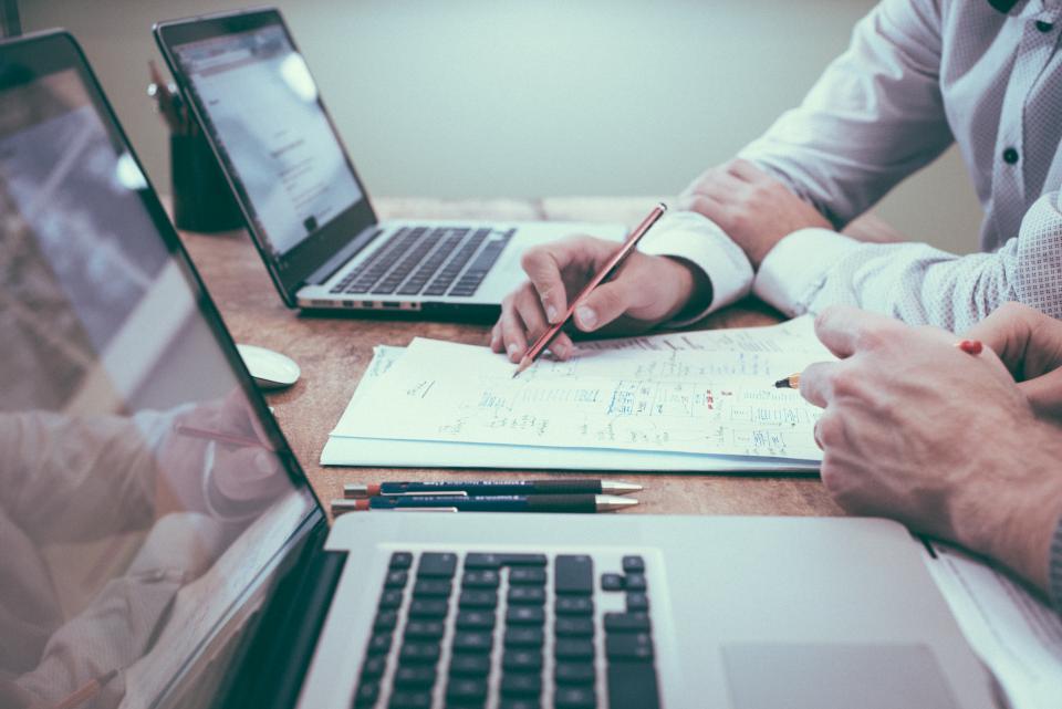 How to Secure Digital Transformation Funding for Emerging Initiatives A modern office space where professionals secure digital transformation funding for tech projects