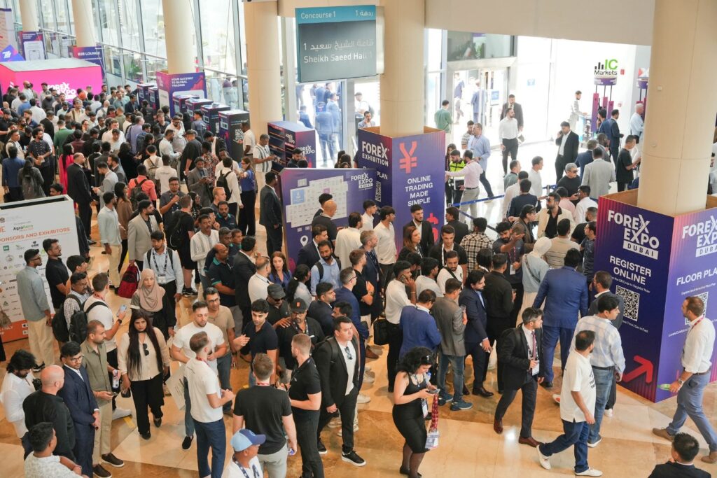Crowds at Forex Expo Dubai walking the exhibition floor at Dubai World Trade Centre