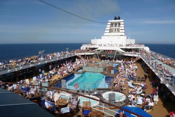 How Much Does It Cost to Live on Cruise Ships Full-Time? A luxury passenger vessel at sea, illustrating what it costs to live on cruise ships full-time.