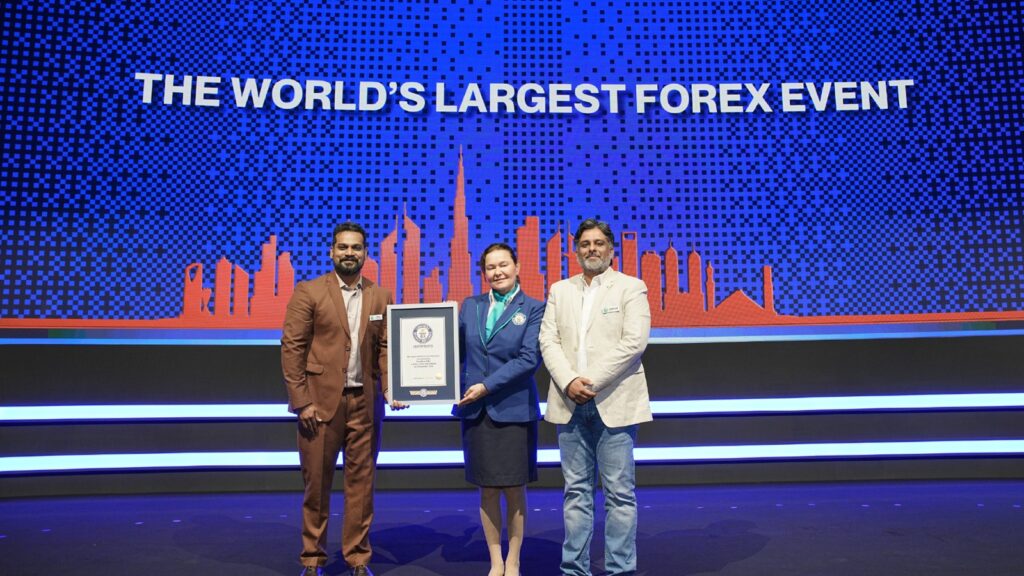 Forex Expo Dubai 2026 Breaks Guinness World Record With 23,816 Attendees Forex Expo Dubai 2026 team receiving the Guinness World Record certificate on stage for the world's largest forex event