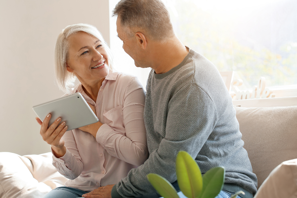 Why Retirees Want Affordable Senior Housing Options in Today’s Market A retired couple discussing affordable senior housing options in a bright living room