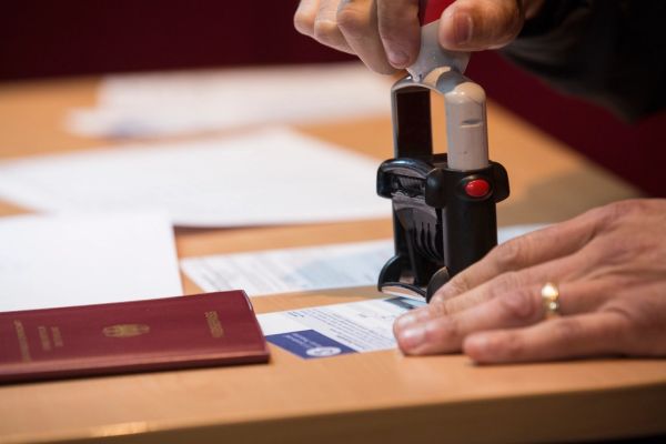 Understanding the US Visa Bulletin for Global Applicants An applicant reviewing documents related to the us visa bulletin